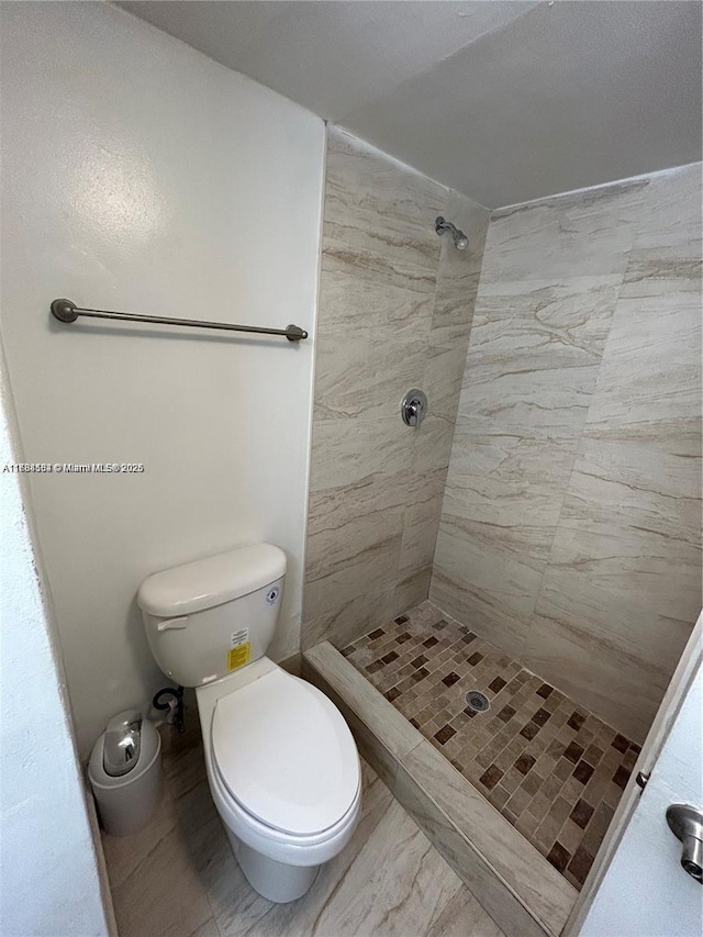 full bath with a shower stall and toilet