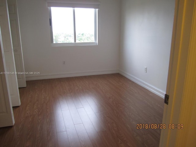 3500 Coral Way Unit 903, Miami, FL 33145 - empty room with wood finished floors and baseboards