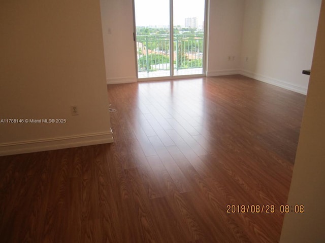 3500 Coral Way Unit 903, Miami, FL 33145 - unfurnished room with baseboards and wood finished floors