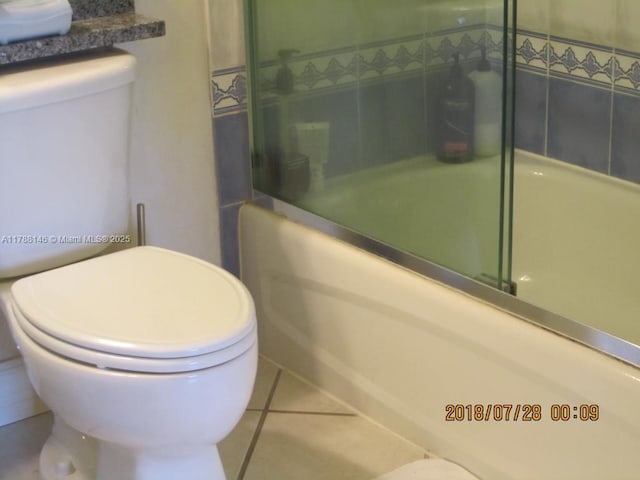 3500 Coral Way Unit 903, Miami, FL 33145 - full bath featuring tile patterned floors, a shower with shower door, and toilet