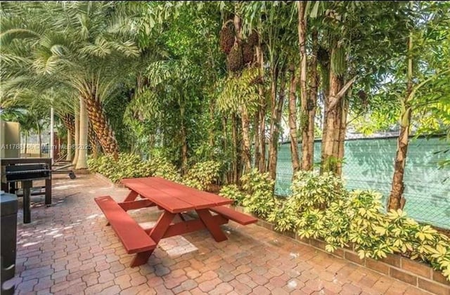 3500 Coral Way Unit 903, Miami, FL 33145 - surrounding community with a patio area and outdoor dining area