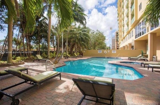 3500 Coral Way Unit 903, Miami, FL 33145 - pool featuring fence and a patio