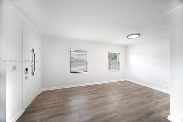 621 Hudson Rd, West Palm Beach, FL 33405 - foyer with crown molding, wood finished floors, and a textured ceiling