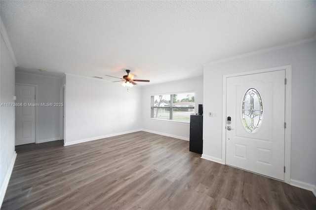 621 Hudson Rd, West Palm Beach, FL 33405 - foyer with dark wood finished floors, crown molding, a textured ceiling, and ceiling fan