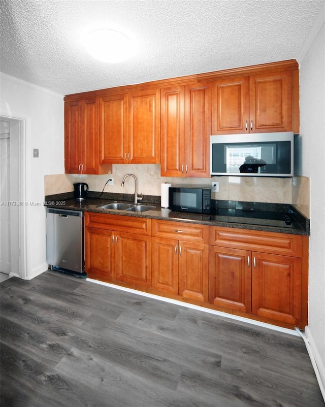 621 Hudson Rd, West Palm Beach, FL 33405 - kitchen featuring brown cabinets, appliances with stainless steel finishes, and a sink