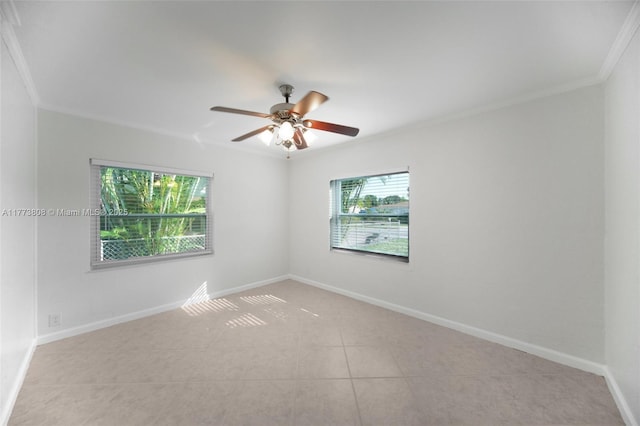 621 Hudson Rd, West Palm Beach, FL 33405 - spare room with a ceiling fan, baseboards, light tile patterned floors, and crown molding