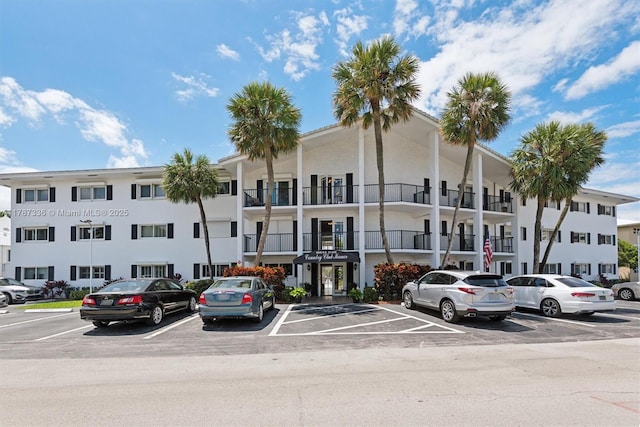 view of property featuring uncovered parking