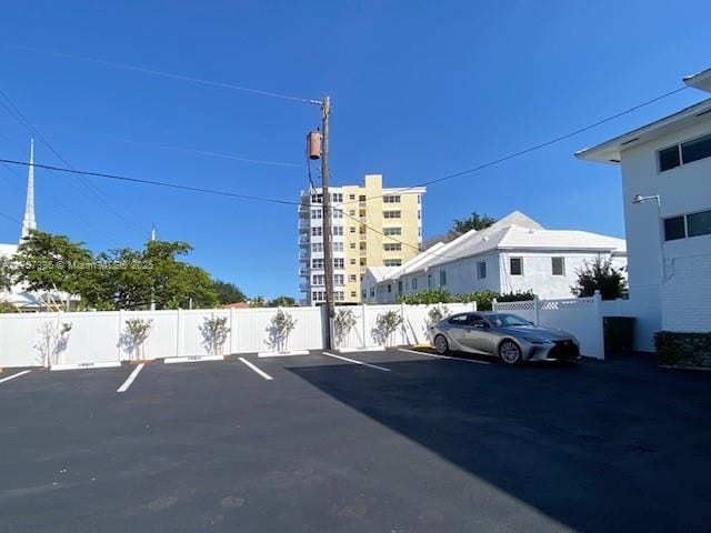uncovered parking lot with fence
