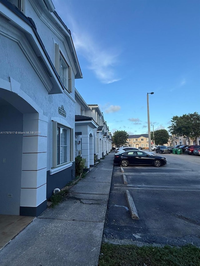 7353 NW 174th Ter Unit 107, Hialeah, FL 33015 - view of asphalt street featuring street lighting and a residential view