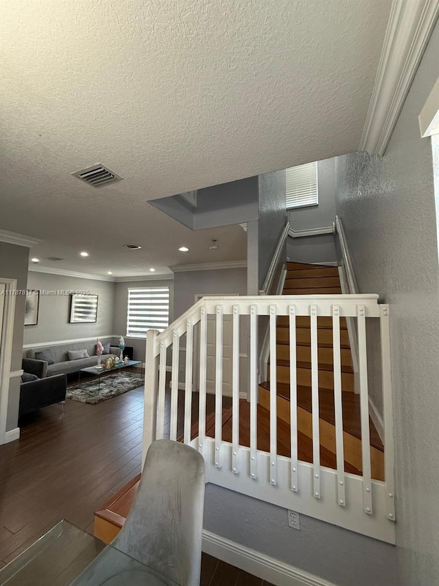 7353 NW 174th Ter Unit 107, Hialeah, FL 33015 - staircase with ornamental molding, a textured ceiling, wood finished floors, and recessed lighting