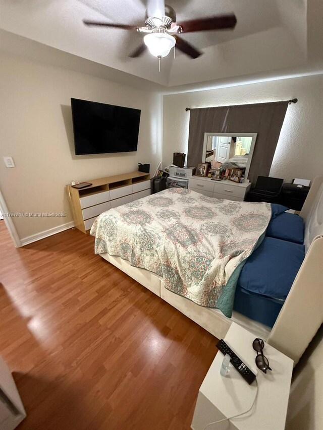 7353 NW 174th Ter Unit 107, Hialeah, FL 33015 - bedroom featuring wood finished floors and ceiling fan