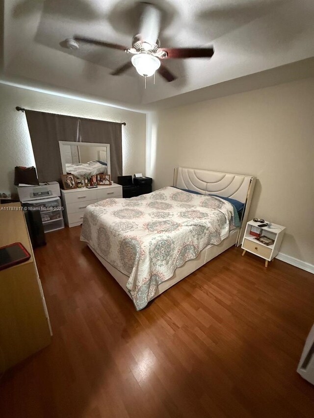 7353 NW 174th Ter Unit 107, Hialeah, FL 33015 - bedroom with dark wood-style floors and a ceiling fan