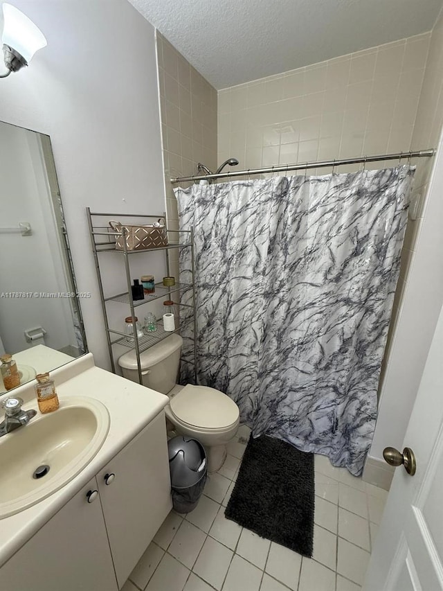 7353 NW 174th Ter Unit 107, Hialeah, FL 33015 - bathroom with vanity, tile patterned floors, a textured ceiling, and a shower with curtain