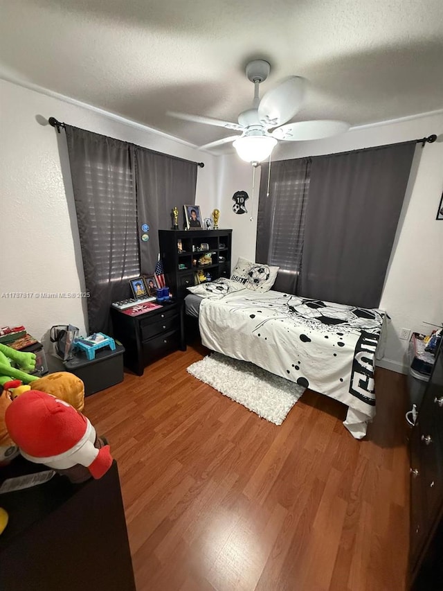 7353 NW 174th Ter Unit 107, Hialeah, FL 33015 - bedroom featuring light wood-type flooring and ceiling fan