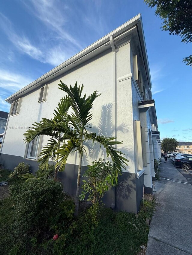 7353 NW 174th Ter Unit 107, Hialeah, FL 33015 - view of home's exterior featuring stucco siding