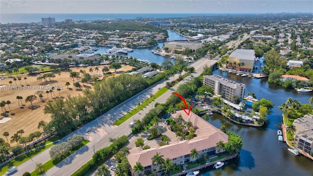birds eye view of property featuring a water view