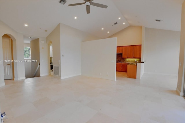 unfurnished living room featuring visible vents, arched walkways, ceiling fan, and high vaulted ceiling