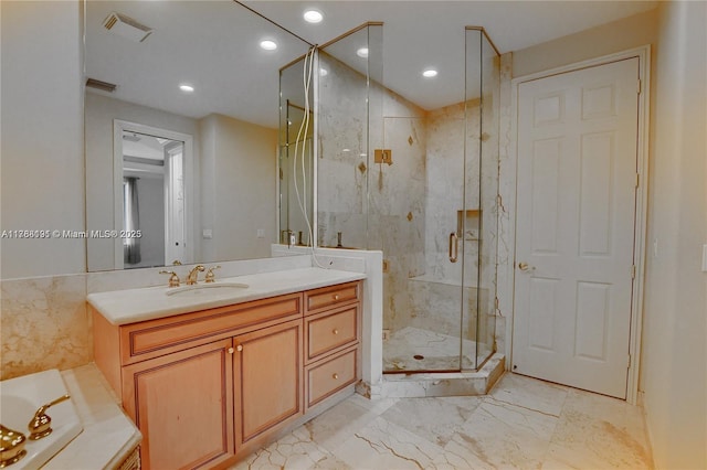 bathroom featuring a marble finish shower, vanity, marble finish floor, visible vents, and recessed lighting