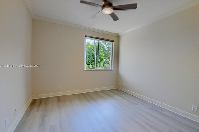 empty room featuring a ceiling fan, baseboards, ornamental molding, and light wood finished floors