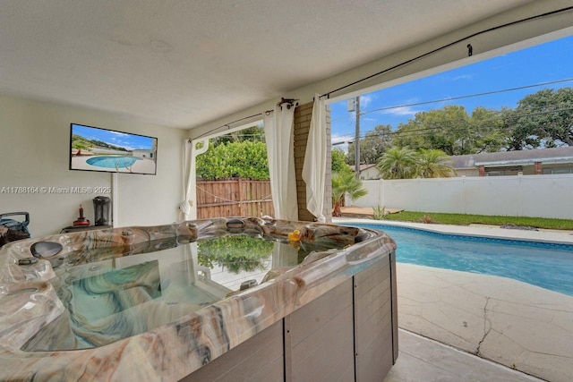 5031 SW 88th Ter, Cooper City, FL 33328 - view of pool with a jacuzzi, a fenced backyard, and a patio area