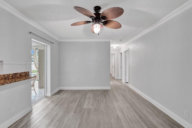 5031 SW 88th Ter, Cooper City, FL 33328 - unfurnished room featuring light wood-style flooring, ceiling fan, crown molding, and a textured ceiling