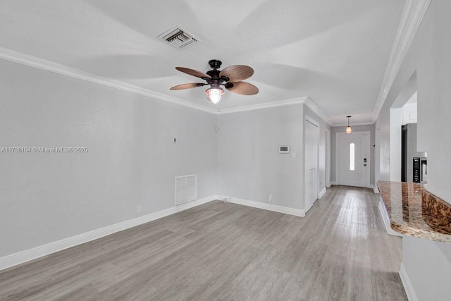 5031 SW 88th Ter, Cooper City, FL 33328 - spare room featuring ceiling fan, ornamental molding, and light wood-type flooring