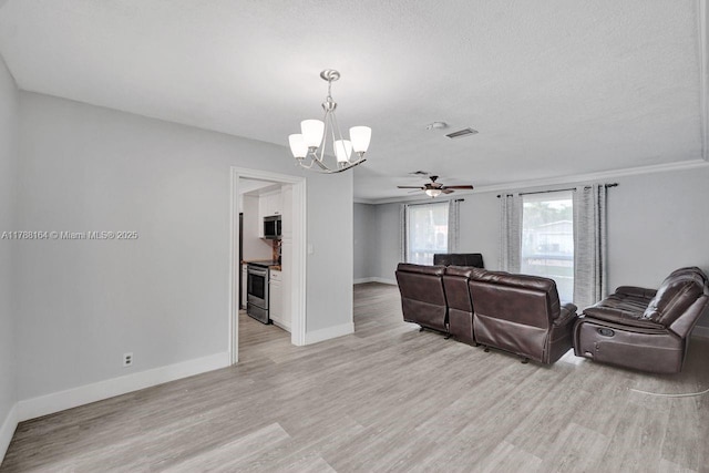 5031 SW 88th Ter, Cooper City, FL 33328 - living room featuring a chandelier, light wood-type flooring, ceiling fan, and crown molding