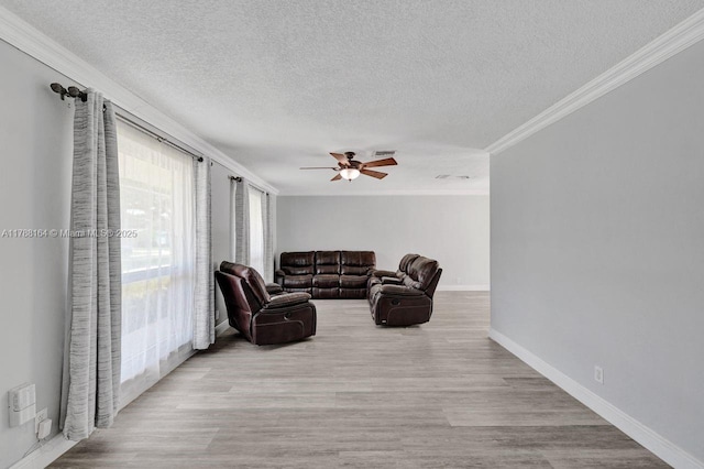 5031 SW 88th Ter, Cooper City, FL 33328 - living area with crown molding, ceiling fan, a textured ceiling, and wood finished floors
