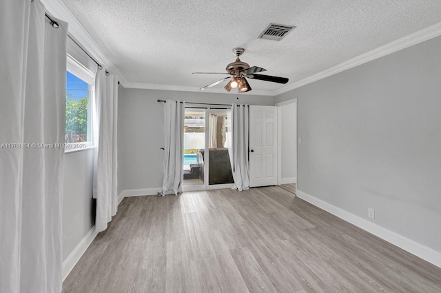 5031 SW 88th Ter, Cooper City, FL 33328 - unfurnished room with a textured ceiling, light wood-type flooring, a ceiling fan, and ornamental molding