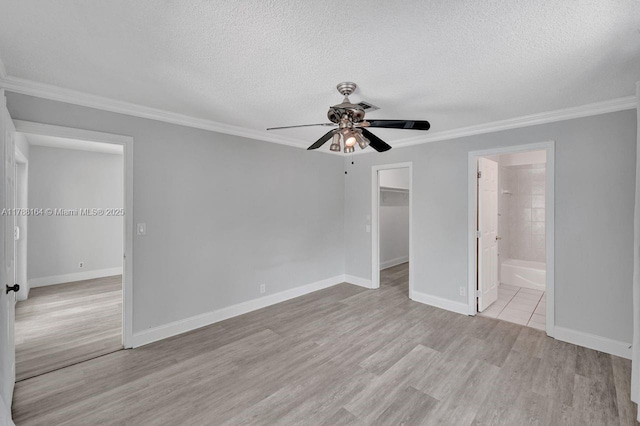 5031 SW 88th Ter, Cooper City, FL 33328 - spare room featuring a ceiling fan, a textured ceiling, wood finished floors, and ornamental molding