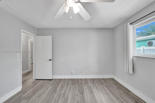 5031 SW 88th Ter, Cooper City, FL 33328 - unfurnished room with wood finished floors, a textured ceiling, and a ceiling fan