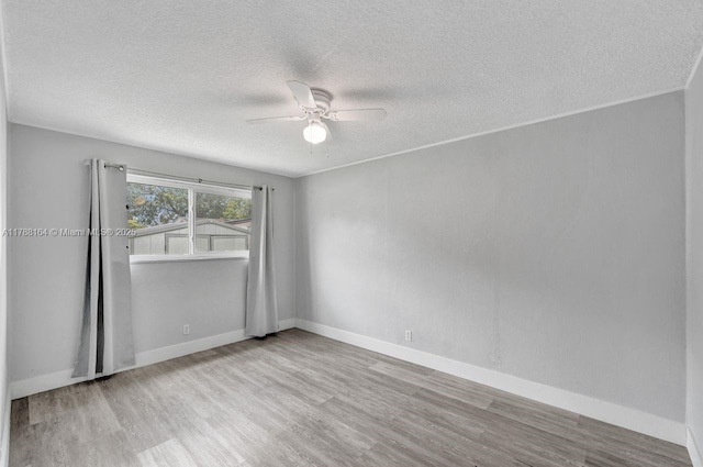 5031 SW 88th Ter, Cooper City, FL 33328 - spare room featuring a textured ceiling, a ceiling fan, and wood finished floors