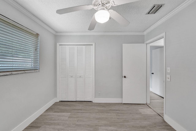 5031 SW 88th Ter, Cooper City, FL 33328 - unfurnished bedroom with a textured ceiling, a closet, wood finished floors, ornamental molding, and ceiling fan