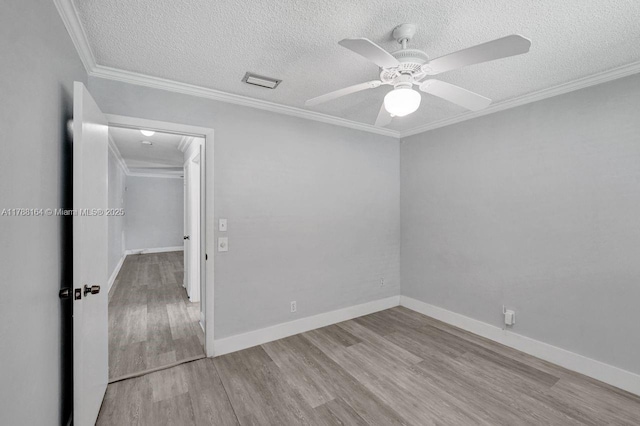 5031 SW 88th Ter, Cooper City, FL 33328 - spare room featuring wood finished floors, a ceiling fan, a textured ceiling, and ornamental molding