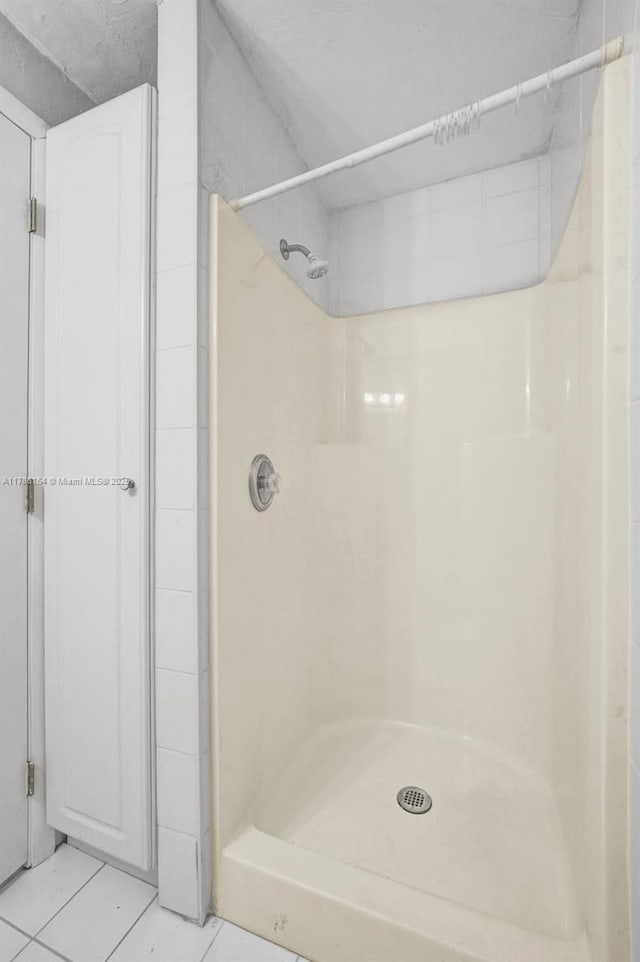 5031 SW 88th Ter, Cooper City, FL 33328 - bathroom featuring tile patterned flooring and a shower
