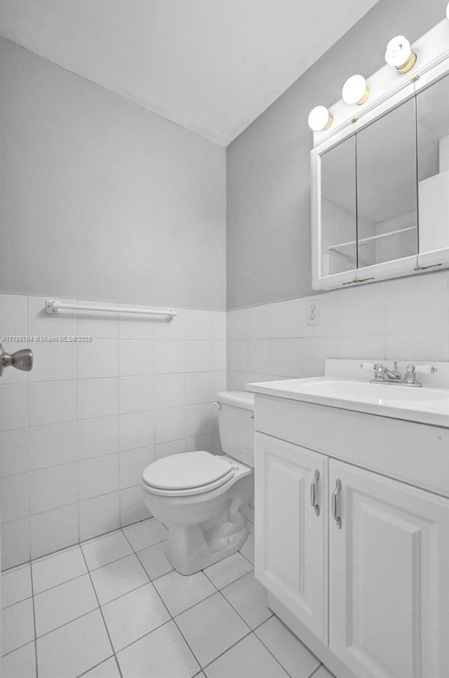5031 SW 88th Ter, Cooper City, FL 33328 - half bathroom with tile walls, vanity, and a wainscoted wall