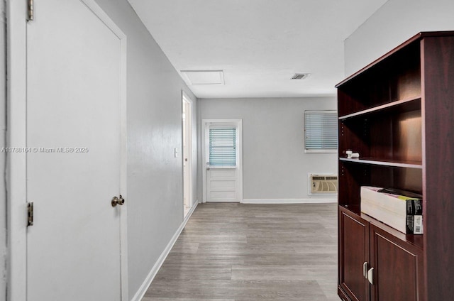 5031 SW 88th Ter, Cooper City, FL 33328 - hallway featuring attic access, light wood-style floors, and a wall mounted AC