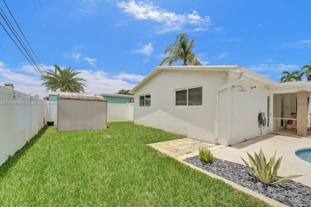 5031 SW 88th Ter, Cooper City, FL 33328 - rear view of house with a storage unit, a fenced backyard, a patio area, and stucco siding