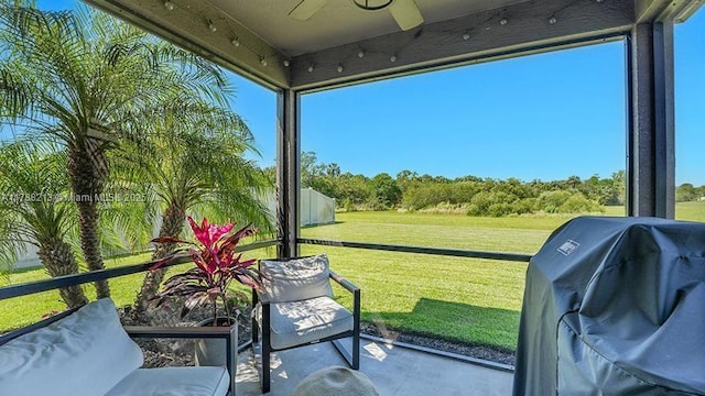 sunroom with a ceiling fan