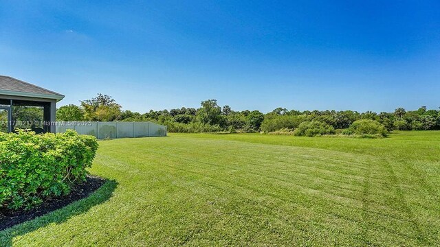 view of yard featuring fence