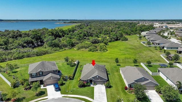 drone / aerial view featuring a residential view and a water view