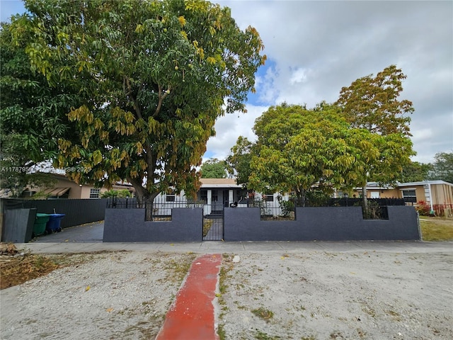 11712 NW 3rd Ave, Miami, FL 33168 - view of front of property with a gate and a fenced front yard