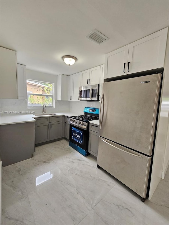 11712 NW 3rd Ave, Miami, FL 33168 - kitchen featuring appliances with stainless steel finishes, visible vents, marble finish floor, and a sink