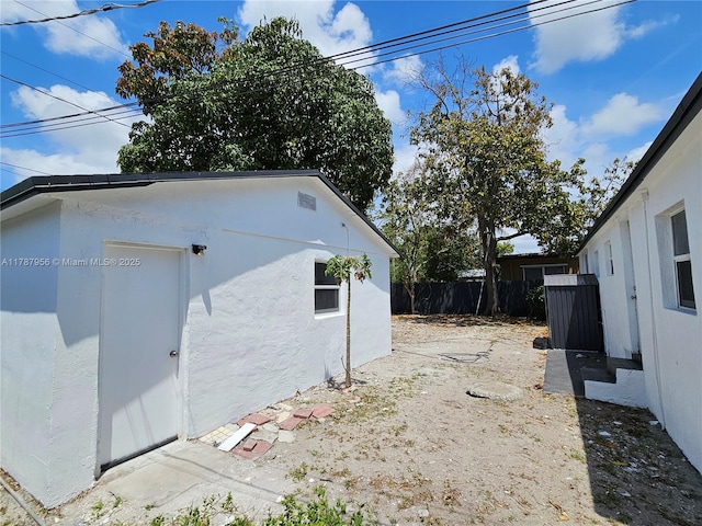 11712 NW 3rd Ave, Miami, FL 33168 - view of property exterior with stucco siding and fence