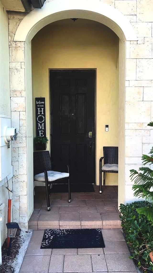 10315 W 32nd Ln, Hialeah, FL 33018 - doorway to property with stone siding