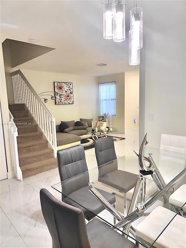 10315 W 32nd Ln, Hialeah, FL 33018 - dining room with marble finish floors, stairs, and a chandelier