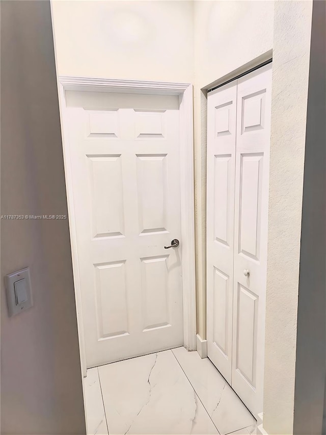 10315 W 32nd Ln, Hialeah, FL 33018 - hall featuring light marble finish floors