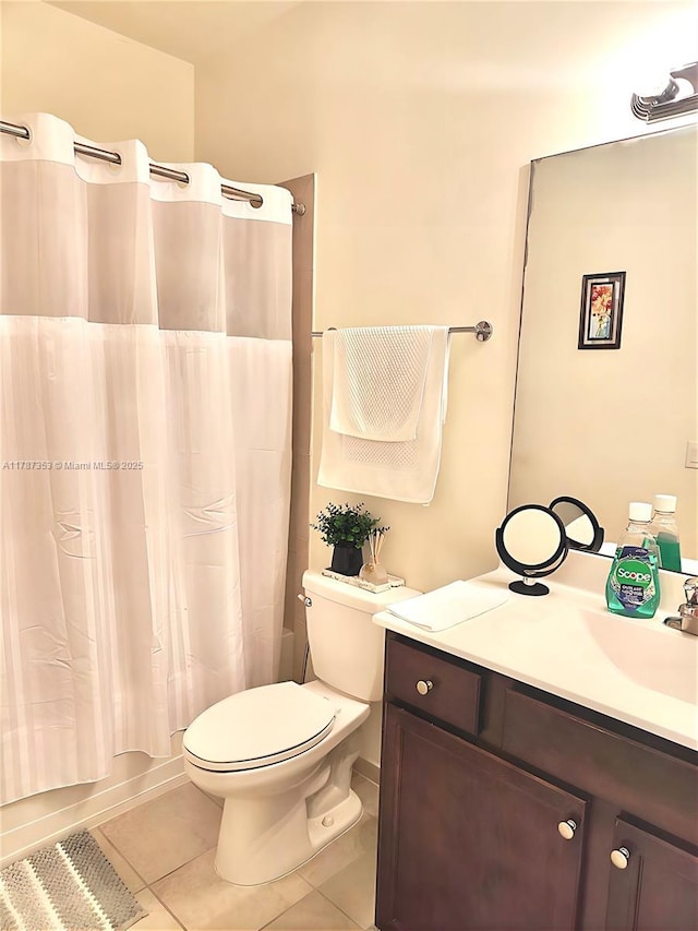 10315 W 32nd Ln, Hialeah, FL 33018 - bathroom with tile patterned floors, vanity, toilet, and shower / bath combo with shower curtain