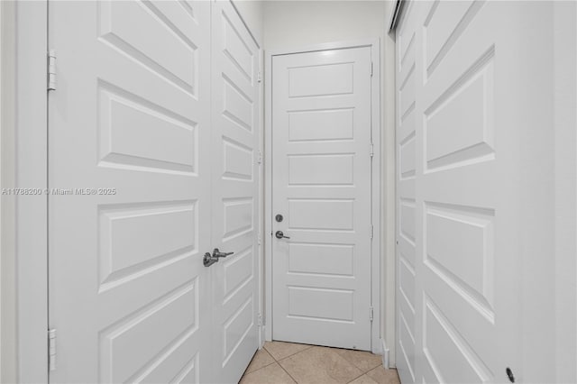 doorway to outside featuring light tile patterned floors