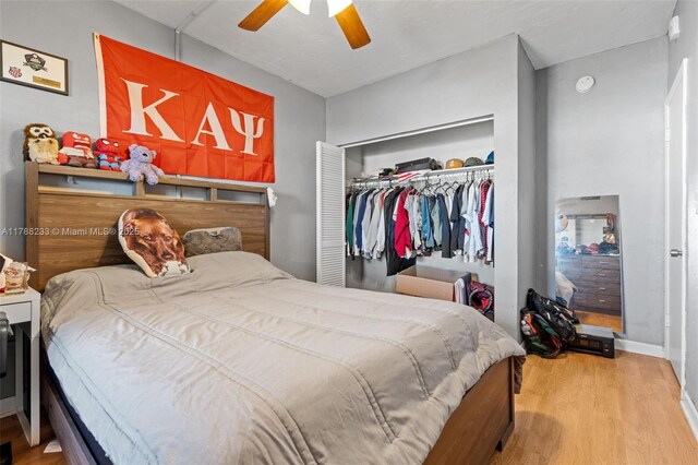 1205 Mariposa Ave Unit 413, Coral Gables, FL 33146 - bedroom with wood finished floors, a ceiling fan, baseboards, and a closet